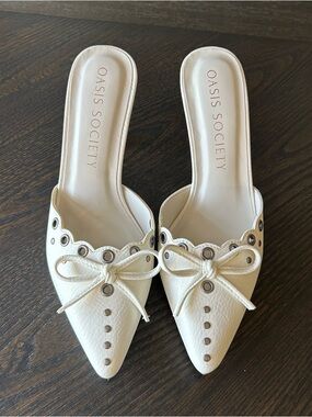 Oasis Society White Leather Pointed Mule with Bow & Grommet Accents
